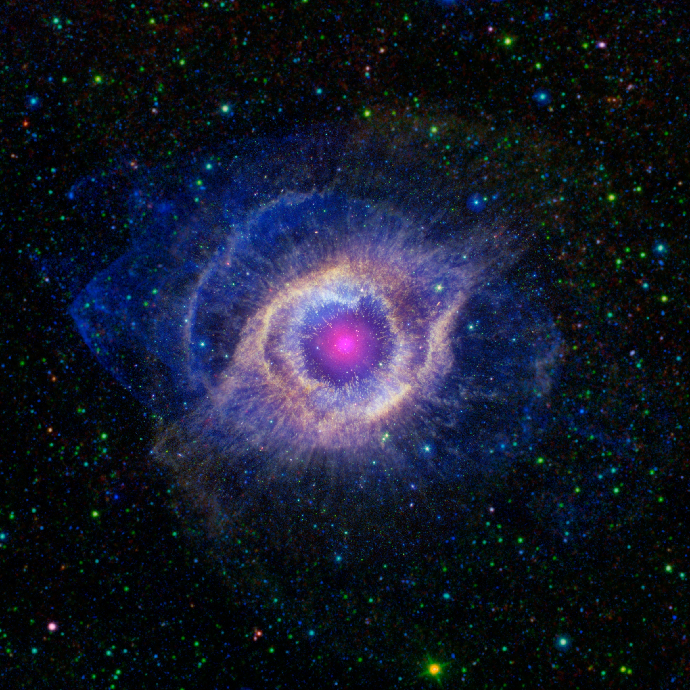 A pink circle surrounded by different layers of color with a black background.