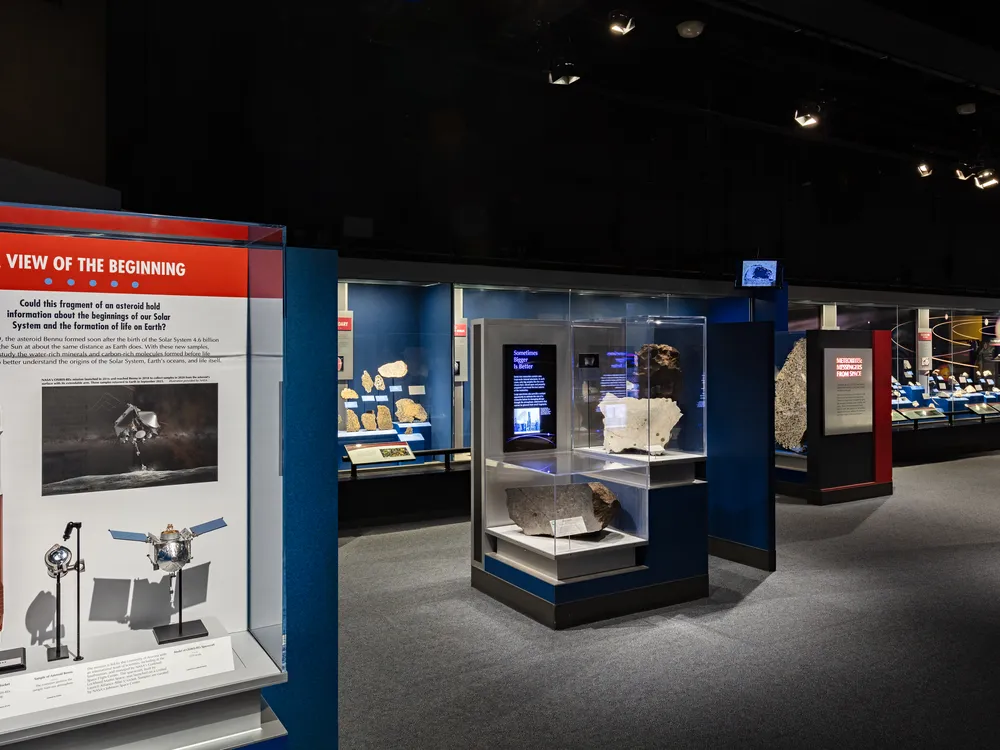 The Bennu asteroid sample in a museum case.