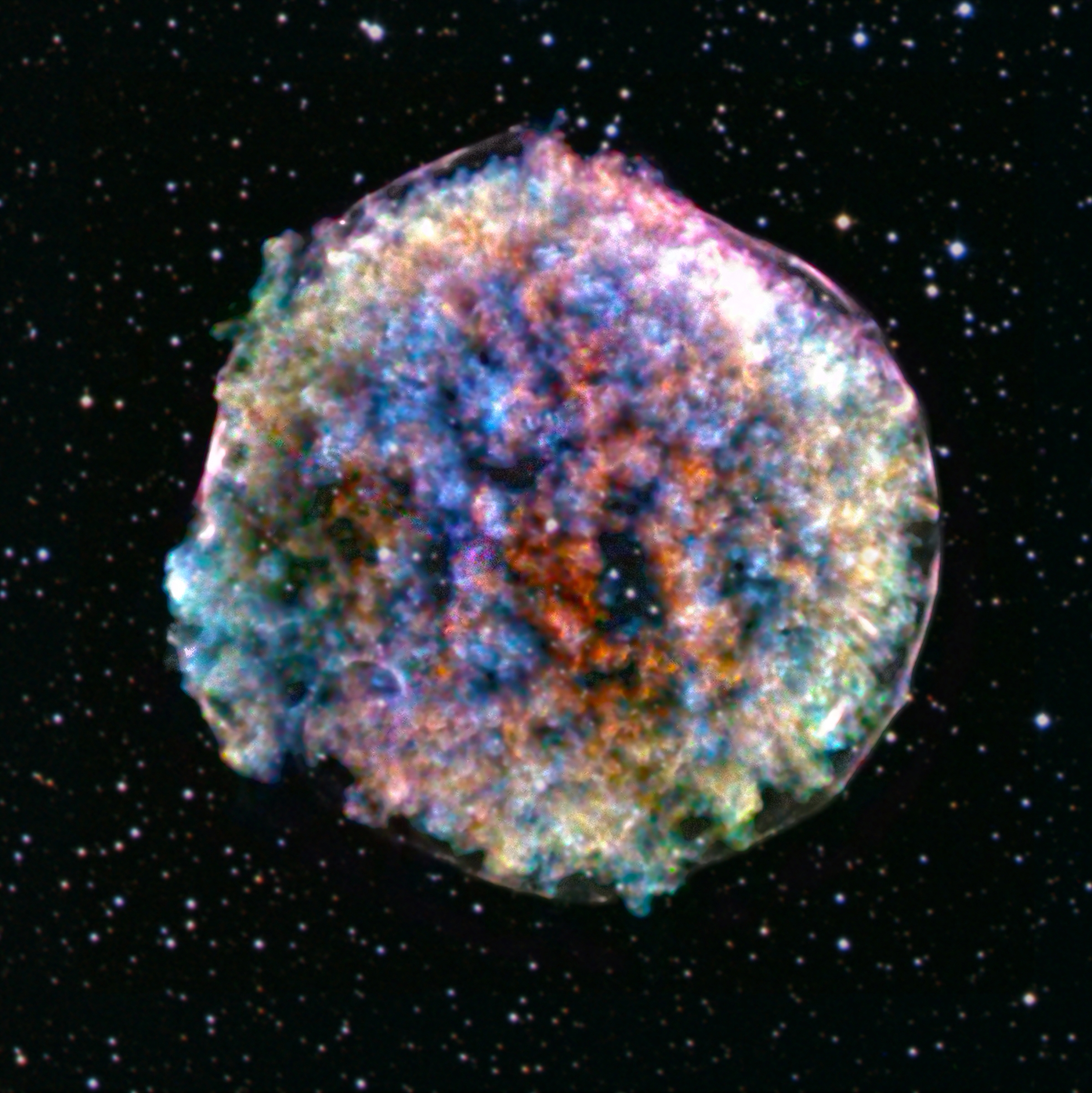 A blur of multicolored spots on a black background.